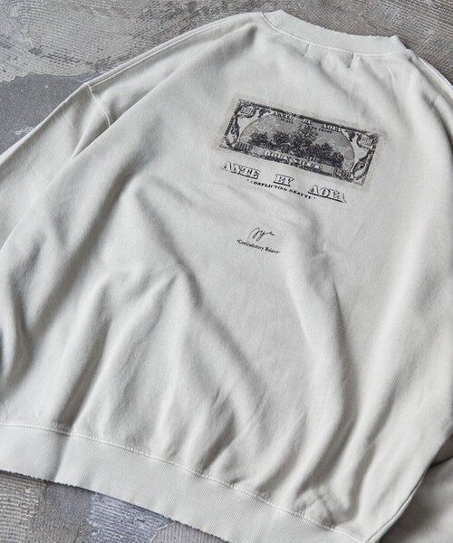 PUBLUX(パブリュクス)の「PUBLUX/パブリュクス ANTE 別注 Fake Money プリント裏毛スウェット【限定展開】(スウェット・メンズ・オフホワイト/スミクロ・SMALL/MEDIUM/LARGE)」の6枚目の写真