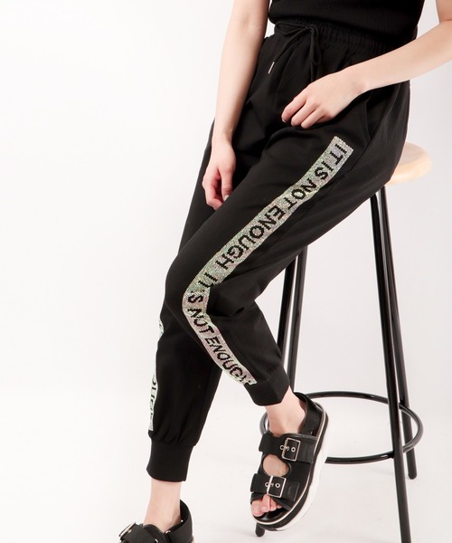 BLACK JACKALL CROWN(ブラックジャッカルクラウン)の「BLACK JACKALL CROWN ポンチ サイドジルコンプリント ジョガー トラックパンツ(その他パンツ・レディース・ブラック・M)」の1枚目の写真