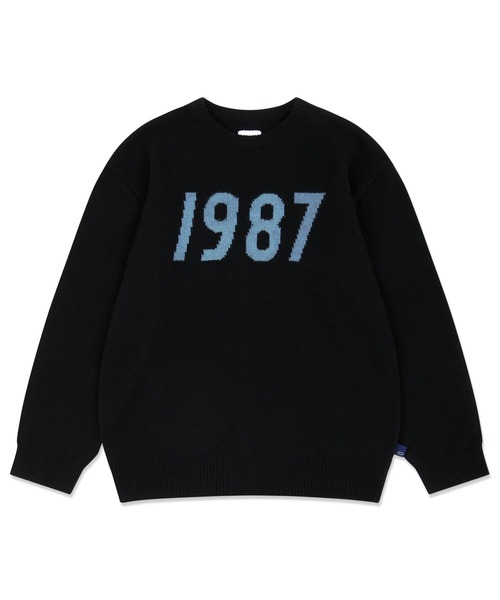 87mm(87mm)の「【87MM / Mmlg】1987 INTARSIA KNIT / パルチムエムエム MMLG 1987 ロゴ クルーネック ニット(ニット/セーター・レディース・ブラック/グレー/オレンジ・MEDIUM/LARGE)」の2枚目の写真