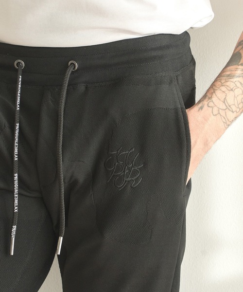 1piu1uguale3 RELAX（ウノピュウノウグァーレトレリラックス）の「【1PIU1UGUALE3 RELAX/ウノピゥウノウグァーレトレ リラックス/別注/セットアップ対応/ストレッチ素材】カモ柄ニットジャガード スリムイージーパンツ（スウェットパンツ・メンズ・ブラック・M/L/LL）」の12枚目の写真