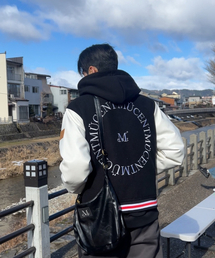 MUCENT（ムセント）の「ティーバートンシグネチャーバーシティジャケット (男女共用)（スタジャン）」