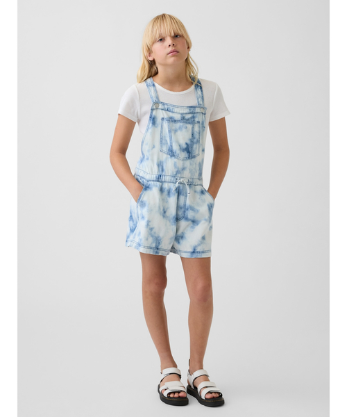 GAP(ギャップ)の「タイダイ柄 デニム リラックスフィット ショートオール (キッズ)(サロペット/オーバーオール・キッズ・ブルー・150cm/140cm/130cm/120cm/110cm/160cm)」の1枚目の写真
