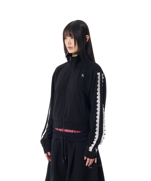 AAKAM(アーカム)の「Laced Track Jacket (Black)(ナイロンジャケット・レディース・その他・FREE)」の1枚目の写真