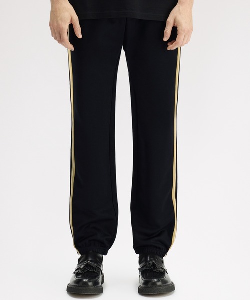 FRED PERRY(フレッドペリー)の「先行予約受付中/Stripe Tape Track Pants/ストライプテープトラックパンツ(その他パンツ・メンズ・ブラック・S/M/L)」の1枚目の写真