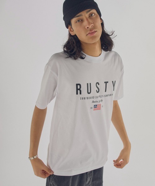 RUSTY(ラスティ)の「【RUSTY:ラスティー】半袖ロゴTシャツ(Tシャツ/カットソー・メンズ・ブルー/ベージュ/ブラック/ホワイト・X-LARGE/LARGE/MEDIUM)」の1枚目の写真