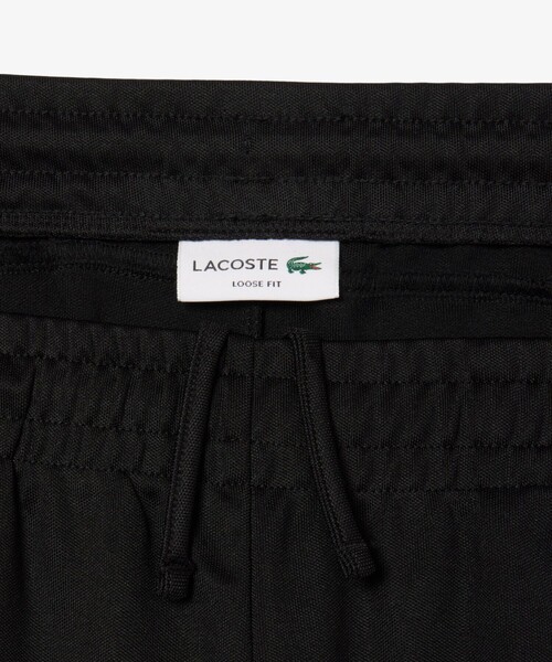 LACOSTE(ラコステ)の「サイドパイピングルーズフィットトラックパンツ(スウェットパンツ・メンズ・ブラック・2/4/3/5)」の6枚目の写真