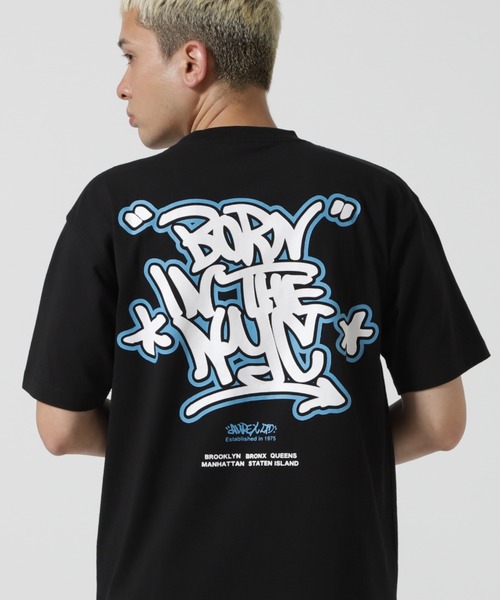 AVIREX（アヴィレックス）の「《直営店限定》GRAFFITI T-SHIRT "BORN IN THE NYC" / グラフィティ Tシャツ "ボーン イン ザ ニューヨーク" / AVIREX / アヴィレックス（Tシャツ/カットソー・メンズ・オリーブ系/ネイビー/ホワイト/ブラック・M/L/2XL/XL）」の6枚目の写真