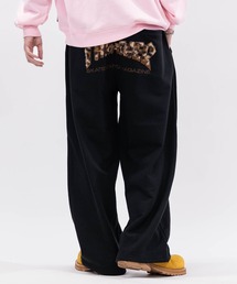 JOHN'S CLOSET（ジョンズクローゼット）の「【at】〔THRASHER/スラッシャー〕アソートアップリケ コクーンシルエット スウェットパンツ（スウェットパンツ）」