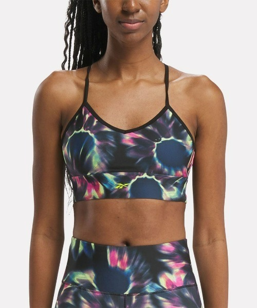 Reebok(リーボック)の「トレイン プリント ブラ / ID TRAIN AOP BRA(スポーツブラ・レディース・グレー系その他/ブラック系その他・X-SMALL/X-LARGE/XX-LARGE/SMALL/MEDIUM/LARGE)」の1枚目の写真