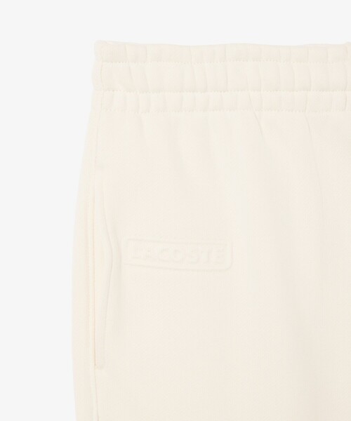 LACOSTE（ラコステ）の「エンボスロゴスウェットトラックパンツ（スウェットパンツ・レディース・オフホワイト・34/36/38/40）」の2枚目の写真