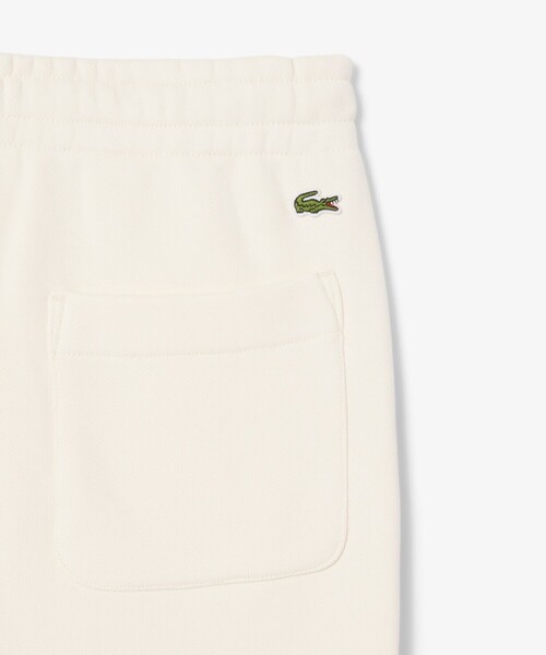 LACOSTE（ラコステ）の「エンボスロゴスウェットトラックパンツ（スウェットパンツ・レディース・オフホワイト・34/36/38/40）」の3枚目の写真