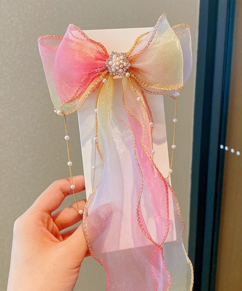 CALIFORNIA OUTFITTERS（カリフォルニア アウトフィッターズ）の「7B26 プリンセス オーロラカラー パールビジューリボンヘアクリップ（バレッタ/ヘアクリップ・キッズ・パープル/イエロー/ピンク/ブルー/ホワイト・ONESIZE）」の5枚目の写真