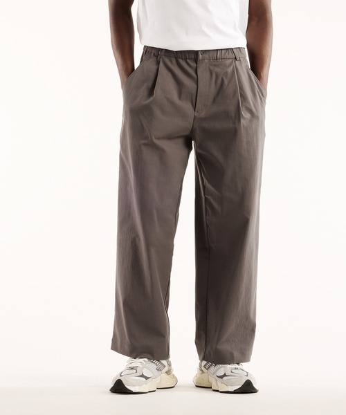 NEW BALANCE(ニューバランス)の「NB GREY ワイドパンツ(スラックス・メンズ・ブラック/ブルーグレー・SMALL/MEDIUM/LARGE/X-LARGE/XX-LARGE)」の1枚目の写真