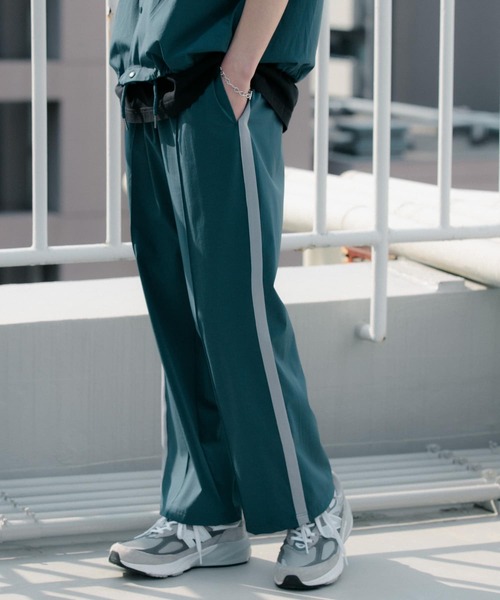 Uiscel(ユイセル)の「Uiscel 4wayストレッチサイドラインパンツ(その他パンツ・メンズ・ブラック/ブルー・MEDIUM/LARGE)」の9枚目の写真