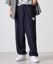 MODISH GAZE（モディシュガゼ）の「MODISH GAZE 発泡プリント 裏毛スウェットパンツ ハートロゴ（スウェットパンツ・メンズ）」