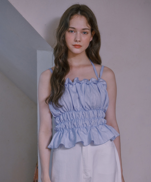 LULUCHOU(ルルシュ)の「Shirring Glitter Bustier - SKY BLUE(Tシャツ/カットソー・レディース・スカイブルー・FREE)」の1枚目の写真