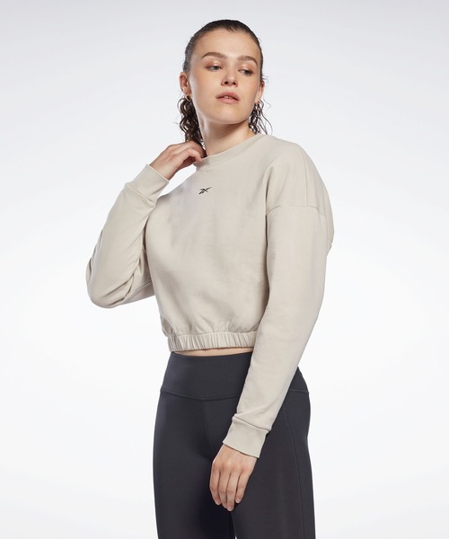 Reebok(リーボック)の「DreamBlend コットンミッドレイヤー スウェットシャツ / DreamBlend Cotton Midlayer Sweatshirt(スウェット・レディース・ブラック/ベージュ系その他・X-SMALL/MEDIUM/X-LARGE/LARGE/XX-LARGE/SMALL)」の1枚目の写真