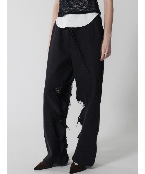 ELCHELE（エルチェレ）の「INSIDE RIPPED HOLE PANTS（スウェットパンツ・レディース・ナチュラル/ブラック・36/38）」の3枚目の写真