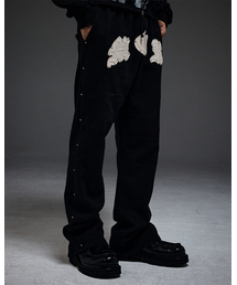 MWOONG（ムン）の「M.C.R. code stud P BK F（スウェットパンツ）」