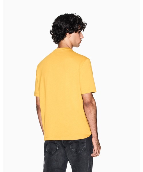 ARMANI EXCHANGE(アルマーニエクスチェンジ)の「【A|X アルマーニ エクスチェンジ】オールオーバーロゴポケット 半袖クルーネックTシャツ/REGULAR+(Tシャツ/カットソー・メンズ・ダークネイビー/マスタード・LARGE/MEDIUM/SMALL/X-LARGE/X-SMALL/XX-LARGE)」の6枚目の写真