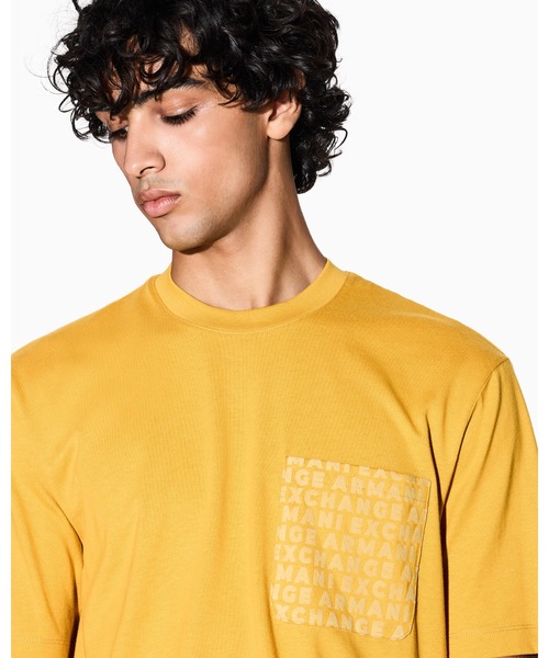 ARMANI EXCHANGE(アルマーニエクスチェンジ)の「【A|X アルマーニ エクスチェンジ】オールオーバーロゴポケット 半袖クルーネックTシャツ/REGULAR+(Tシャツ/カットソー・メンズ・ダークネイビー/マスタード・LARGE/MEDIUM/SMALL/X-LARGE/X-SMALL/XX-LARGE)」の9枚目の写真