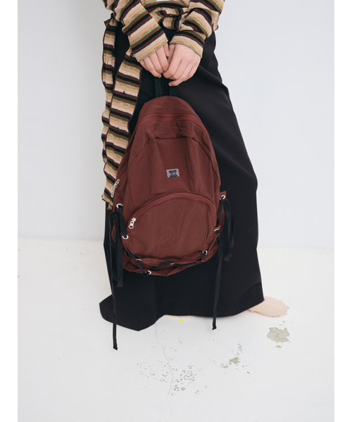MUWM(ムウム)の「ネストリボンナイロンバックパック Nest Backpack (プラムレッド)(バックパック/リュック・レディース・その他・FREE)」の1枚目の写真