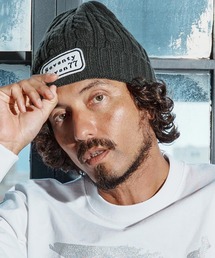 seventy seven（セブンティセブン）の「mko13167-cable knit cap(logo patch) ニットキャップ(7725W310)（ニットキャップ/ビーニー）」