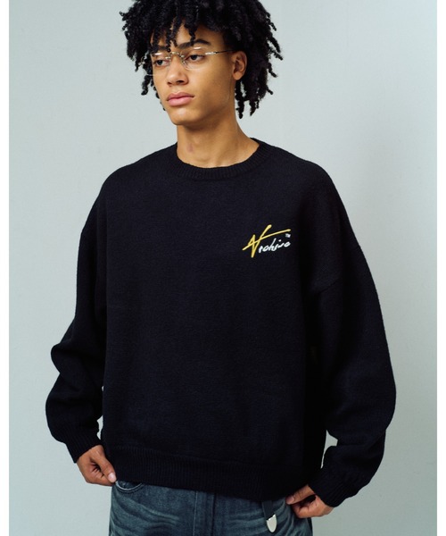 ADAM PATEK(アダムパテック)の「【ADAMPATEK/アダムパテック】archive shaggy crest crewneck ロゴスウェット(スウェット・メンズ・ブラック×イエロー/ブラック×レッド・1/2)」の1枚目の写真