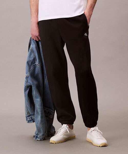 Calvin Klein(カルバン・クライン)の「アーカイブ ロゴ ジョガーパンツ(スウェットパンツ・メンズ・グレー/ブラック・L/M/S)」の21枚目の写真
