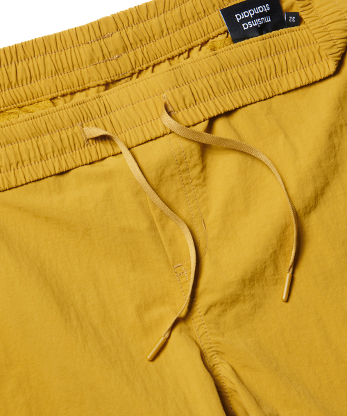 MUSINSA STANDARD（ムシンサスタンダード）の「ナイロンバンディングショーツ_7.5インチ [マスタード]（その他パンツ・メンズ・その他・30/26/28/36/34/32）」の3枚目の写真