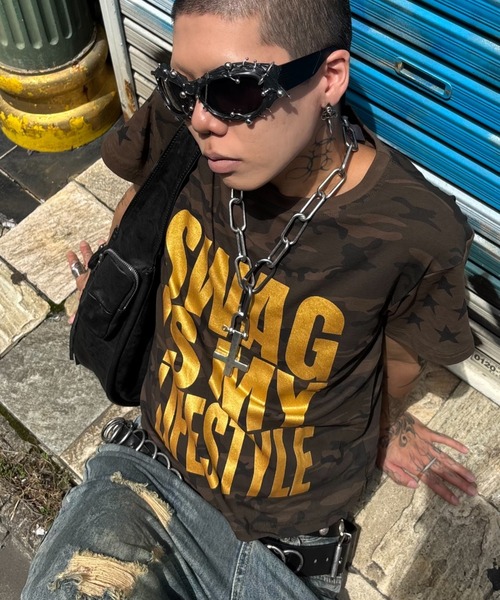 Never mind the XU(ネバーマインドザエックスユー)の「【Never mind the XU】camouflage logo print T-shirt / 【ネバーマインド ザ エックスユー】カモフラージュロゴプリント半袖Tシャツ(Tシャツ/カットソー・メンズ・グリーン系カモフラージュ・M)」の1枚目の写真