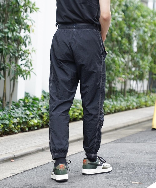 NIKE（ナイキ）の「NIKE AS M NSW WR LND WVN PANT SW5 DM6859-010