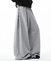 JOHNNY WOLF（ジョニーウルフ）の「SHESKA ワイドバギー サイド レースアップ スウェットパンツ / ユニセックス メンズ レディース（スウェットパンツ）」