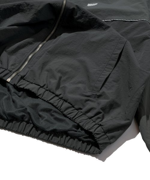 DISCUS ATHLETIC(ディスカス アスレチック)の「ロゴトラックジャケットチャコール(ナイロンジャケット・レディース・その他・MEDIUM/LARGE)」の6枚目の写真