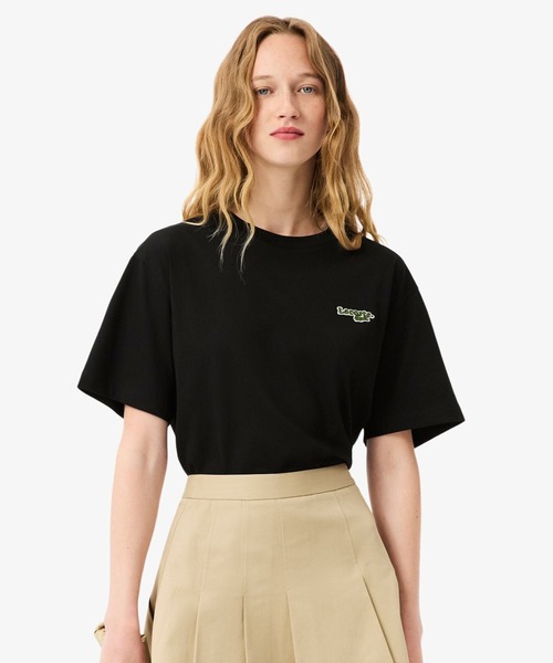 LACOSTE(ラコステ)の「ネーム&ワニロゴパッチオーバーサイズ半袖Tシャツ(Tシャツ/カットソー・レディース・イエロー/ブラック・38/40/34/36)」の1枚目の写真