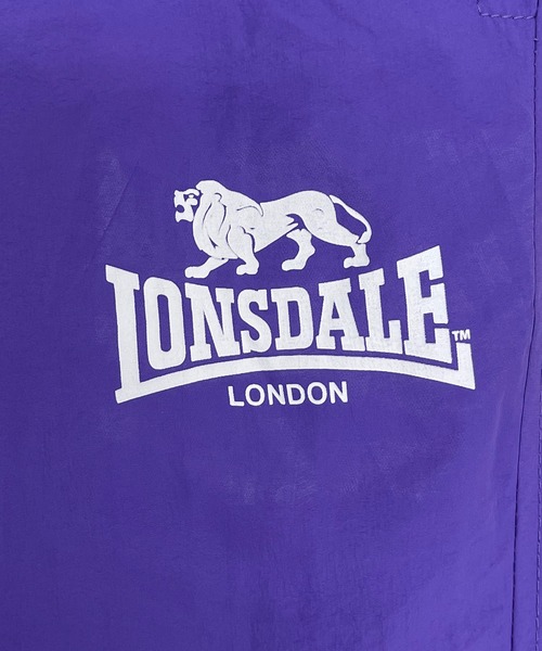 LONSDALE（ロンズデール）の「LONSDALE/ロンズデール セットアップ対応可 ワンポイントロゴ リフレクタープリント 両脇ポケット オーバーサイズ 配色 裏起毛 保温 ウォームアップ トレーニング ナイロンワッシャーパンツ（その他パンツ・メンズ・パープル/グリーン/ブラック・M/L/LL）」の12枚目の写真