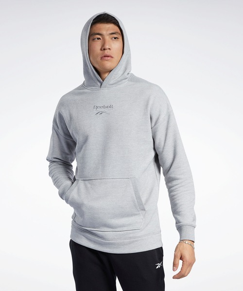 Reebok(リーボック)の「トレーニング エッセンシャルズ メランジ フーディー / Training Essentials Melange Hoodie(パーカー・メンズ・ブラック/ヘザーグレー・SMALL/MEDIUM/LARGE/X-LARGE/XX-LARGE/X-SMALL/XXX-LARGE)」の2枚目の写真