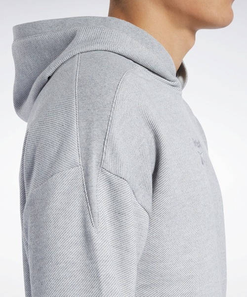 Reebok(リーボック)の「トレーニング エッセンシャルズ メランジ フーディー / Training Essentials Melange Hoodie(パーカー・メンズ・ブラック/ヘザーグレー・SMALL/MEDIUM/LARGE/X-LARGE/XX-LARGE/X-SMALL/XXX-LARGE)」の9枚目の写真