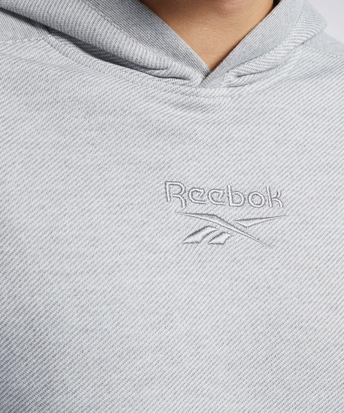 Reebok(リーボック)の「トレーニング エッセンシャルズ メランジ フーディー / Training Essentials Melange Hoodie(パーカー・メンズ・ブラック/ヘザーグレー・SMALL/MEDIUM/LARGE/X-LARGE/XX-LARGE/X-SMALL/XXX-LARGE)」の7枚目の写真