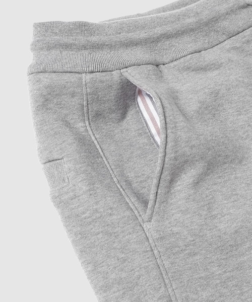 THOM BROWNE(トムブラウン)の「CLASSIC SWEATPANT WITH ENGINEERED 4-BAR IN CLASSIC LOOP BACK(スウェットパンツ・メンズ・ライトグレー/ネイビー・0/1/2)」の5枚目の写真