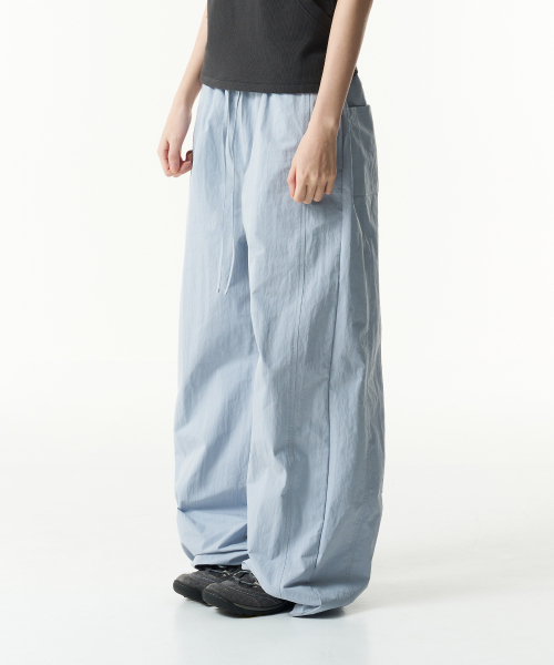THECOLDESTMOMENT(ザコールデストモーメント)の「TCM mini logo nylon pants (sky blue)(スウェットパンツ・レディース・その他・SMALL/MEDIUM/LARGE)」の1枚目の写真