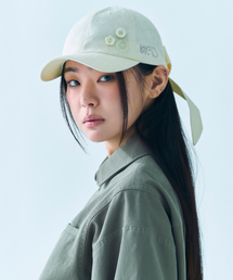 TUOMIO（トゥオミオ）の「BUTTON RIBBON CAP [CREAM]（キャップ）」
