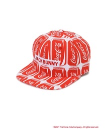 Jack Bunny!!（ジャックバニー）の「【Jack Bunny!! Coca-Cola COLLABORATION】総柄 フラットキャップ (UNISEX)（キャップ・メンズ）」