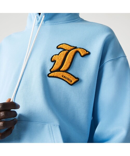LACOSTE L!VE（ラコステライブ）の「LACOSTE L!VE カレッジワッペンフードスウェット（パーカー・メンズ・アイボリー/ライトブルー・L/M/S/XS）」の8枚目の写真