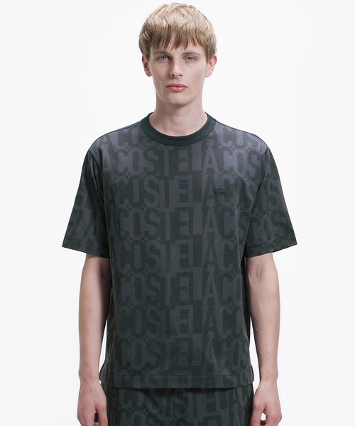 LACOSTE(ラコステ)の「クールマックスブランドネームロゴ総柄Tシャツ(Tシャツ/カットソー・メンズ・ブラウン/オフホワイト/ブラック/チャコール・2/5/4/3)」の1枚目の写真