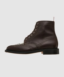 THOM BROWNE（トムブラウン）の「KNEE HIGH CHELSEA BOOT W/ 4 BAR