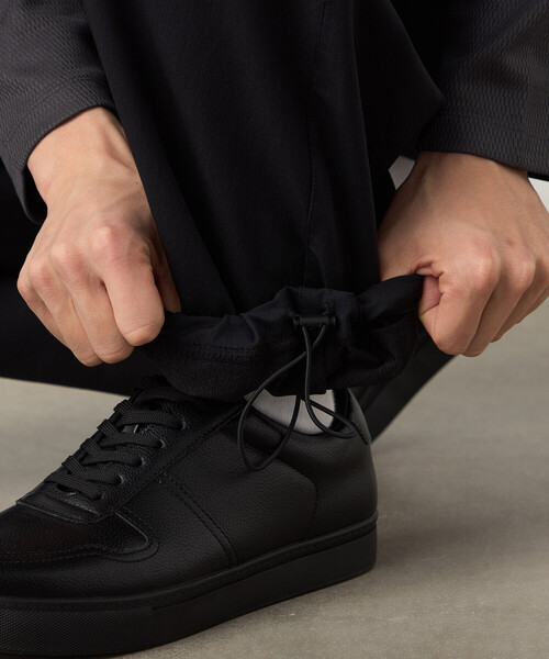 COMME CA ISM(コムサイズム)の「ナイロンストレッチ二重織 パラシュートパンツ(その他パンツ・メンズ・ブラック・LARGE/MEDIUM/SMALL)」の15枚目の写真