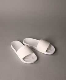 Calvin Klein（カルバン・クライン）の「スライド モノグラムサンダル（サンダル）」