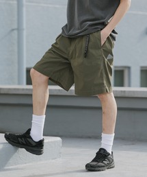 and wander（アンドワンダー）の「and wander/アンドワンダー×Gramicci/グラミチ C/N g-short コラボレーションロゴショーツ 2026年春夏（その他パンツ）」