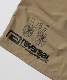 reversal.dogi.design.works（リバーサル・ドーギ・デザイン・ワークス）の「＜reversal/リバーサル＞WARFIELD EDITION PEACE NYLON SHORTS（その他パンツ）」